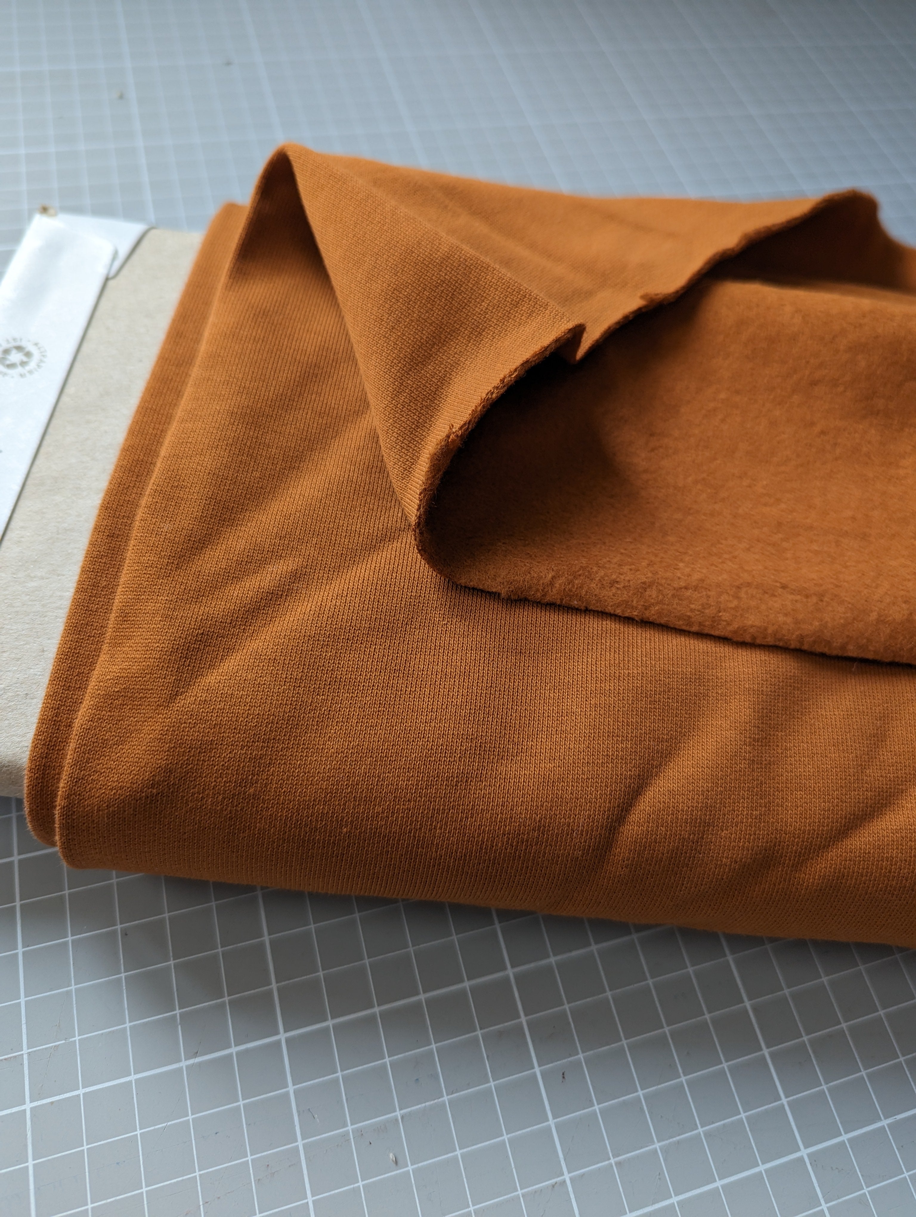 Meterware Sweat Stoff rostorange